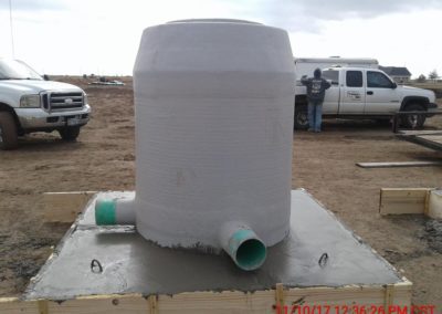 Concrete base with a cylindrical tube on top.